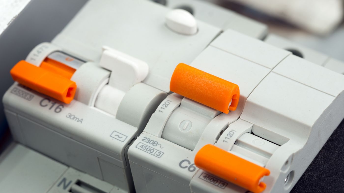 Miniature circuit breakers on a DIN rail, close up